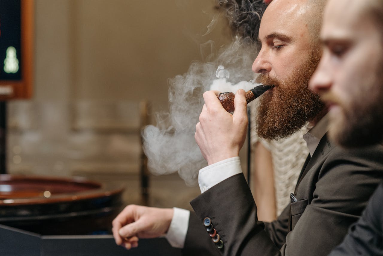 a-man-smoking-using-a-pipe-7594404 a-man-smoking-using-a-pipe-7594404