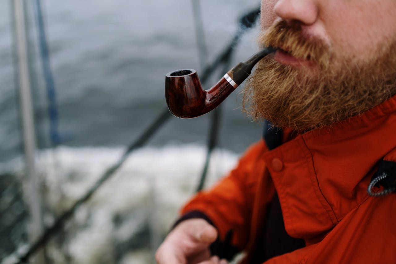 man-in-red-jacket-holding-brown-smoking-pipe-5418550 man-in-red-jacket-holding-brown-smoking-pipe-5418550